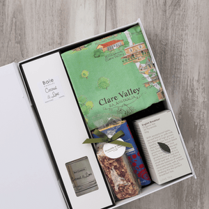 Chocolate, coconut and lime reed diffuser, gourmet nougat, English breakfast tea bags, plus a watercolour-illustrated map cotton tea towel of the Clare Valley and matching greeting card in a gift hamper with free delivery