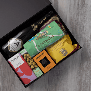 Sparkling wine, gourmet popcorn, artisanal chocolate, hand-roasted macadamias, plus a watercolour-illustrated map cotton tea towel of the Coonawarra and matching greeting card in a gift hamper with free delivery