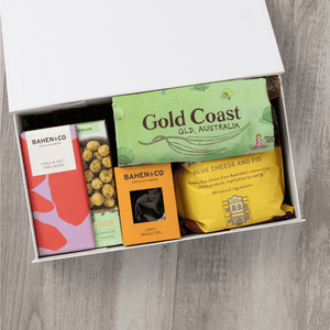 Gourmet popcorn, artisanal chocolate, hand-roasted macadamias, plus a watercolour-illustrated map cotton tea towel of the Gold Coast and matching greeting card in a gift hamper with free delivery