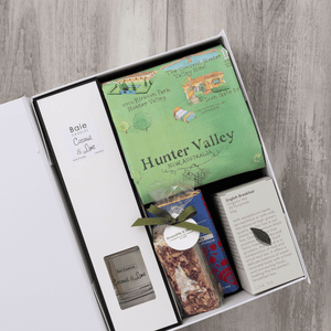 Chocolate, coconut and lime reed diffuser, gourmet nougat, English breakfast tea bags, plus a watercolour-illustrated map cotton tea towel of the Hunter Valley and matching greeting card in a gift hamper with free delivery