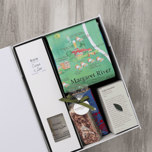 Chocolate, coconut and lime reed diffuser, gourmet nougat, English breakfast tea bags, plus a watercolour-illustrated map cotton tea towel of the Margaret River and matching greeting card in a gift hamper with free delivery