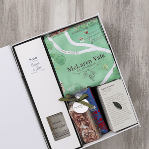 Chocolate, coconut and lime reed diffuser, gourmet nougat, English breakfast tea bags, plus a watercolour-illustrated map cotton tea towel of McLaren Vale and matching greeting card in a gift hamper with free delivery