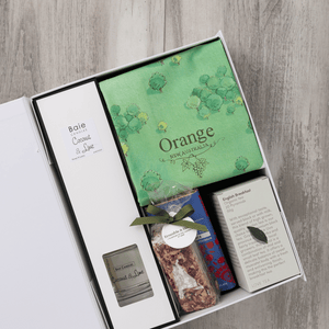 Chocolate, coconut and lime reed diffuser, gourmet nougat, English breakfast tea bags, plus a watercolour-illustrated map cotton tea towel of Orange and matching greeting card in a gift hamper with free delivery