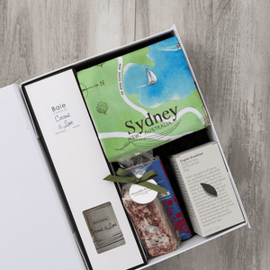 Chocolate, coconut and lime reed diffuser, gourmet nougat, English breakfast tea bags, plus a watercolour-illustrated map cotton tea towel of Sydney and matching greeting card in a gift hamper with free delivery