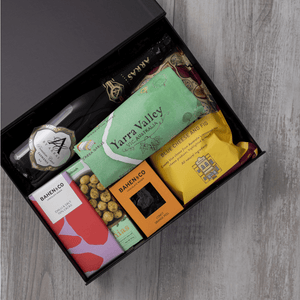 Sparkling wine, gourmet popcorn, artisanal chocolate, hand-roasted macadamias, plus a watercolour-illustrated map cotton tea towel of the Yarra Valley and matching greeting card in a gift hamper with free delivery