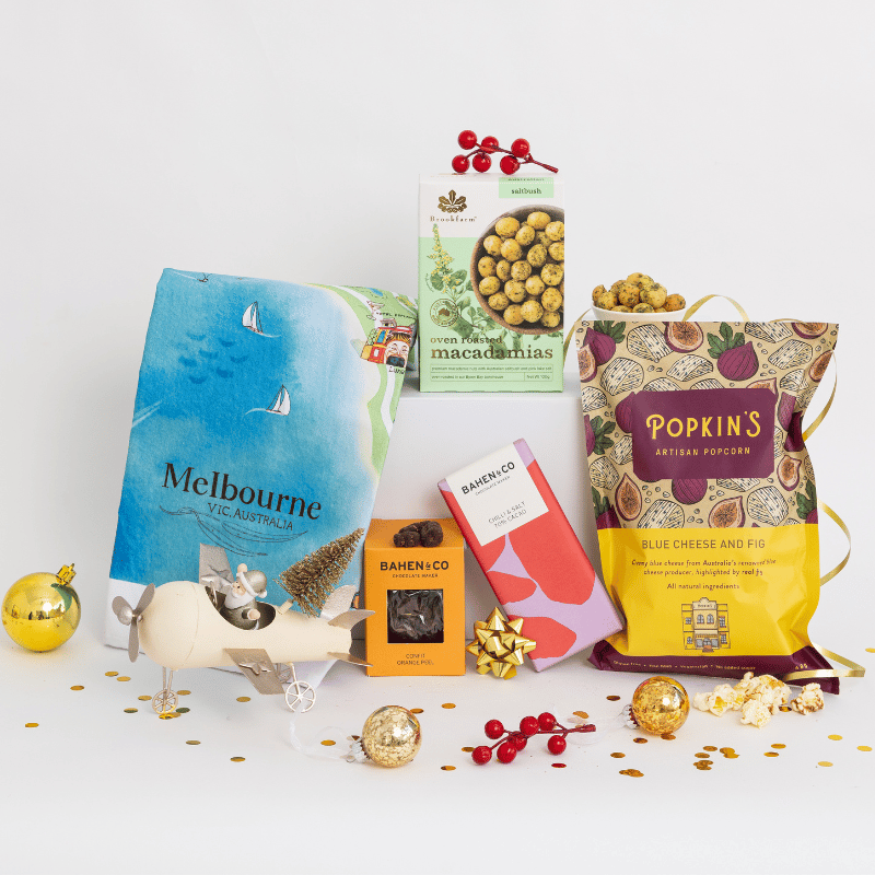 Gourmet popcorn, artisanal chocolate, hand-roasted macadamias, plus your choice of one of 18 locations as a watercolour-illustrated map cotton tea towel and matching greeting card in a gift hamper with free delivery