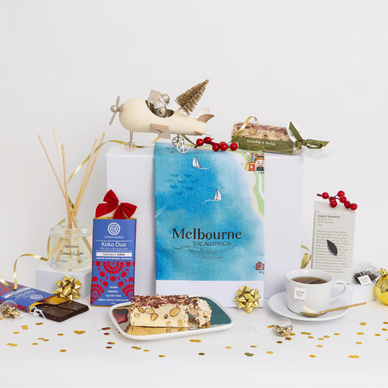 Chocolate, coconut and lime reed diffuser, gourmet nougat, English breakfast tea bags and your choice of one of 18 Australian map tea towels Christmas gift hamper