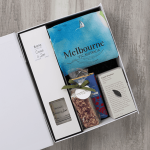 Chocolate, coconut and lime reed diffuser, gourmet nougat, English breakfast tea bags, plus a watercolour-illustrated map cotton tea towel of Melbourne and matching greeting card in a gift hamper with free delivery