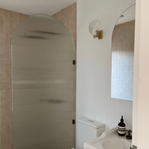 glass clamshell light off in bathroom
